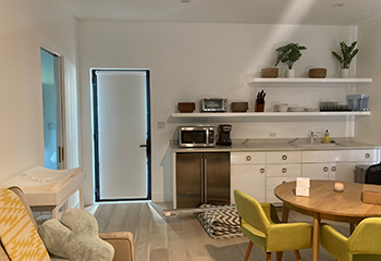Cozy and modern living space with white blackout window shades