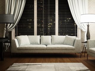 Detail of mini blinds installed in a cozy home environment, enhancing privacy and style.